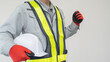 ヘルメットを持つ作業服の男性｜建設業・警備員・ガードマン　イメージ