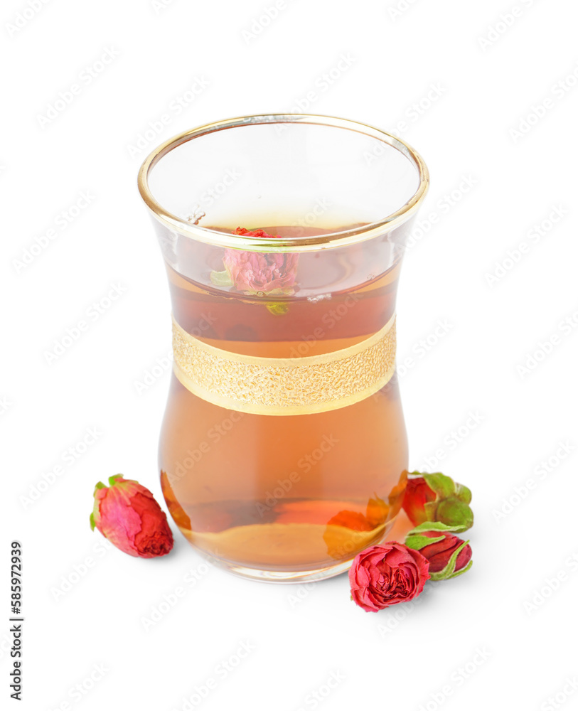 Glass cup of Turkish tea with roses on white background