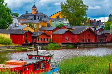 Wall Mural - Sunrise view of red wooden sheds in Finnish town Porvoo