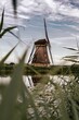 Windmill reflected in the water in Kinderdijk, Netherlands