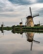 Windmills reflected in the water in Kinderdijk, Netherlands
