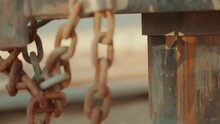 Closeup Of A Rusty Metallic Trailer Hitch In Chains