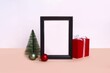 Closeup shot of a Christmas decorative composition with a frame and Christmas tree