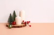 Closeup shot of a Christmas composition with trees and candles on a white background