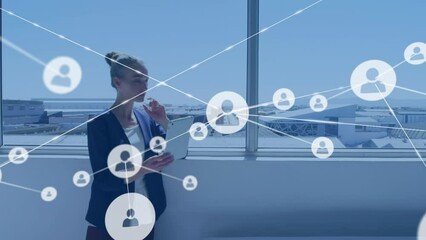 Poster - Animation of network of profile icons over caucasian businesswoman using digital tablet at office