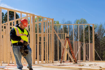 Wall Mural - Worker are building of framing new wooden house