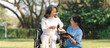 © NanSan - Young asian care helper with asia elderly woman on wheelchair relax together park outdoors to help and encourage and rest your mind with green nature. physical health check