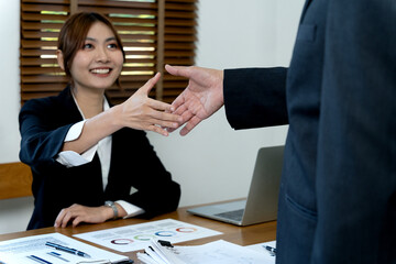 Sticker - young business woman are shaking hands to congratulate the success of the work