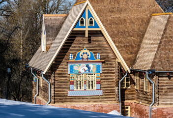 Wall Mural - an old wooden manor painted with ancient fairy tale traditions on a sunny winter day in the suburbs of Veliky Novgorod