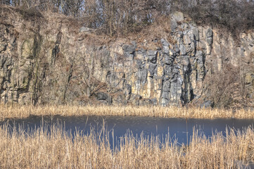 old abandoned stone quarry basalt mine flooded with water