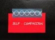 © ariya j - Red stick note with handwriting Self Compassion, refers to ability to relate to self by  forgiving, accepting, and loving in tough situations