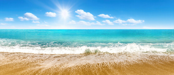 Wall Mural - beautiful panoramic seascape with surf waves against a blue sunny sky with clouds. natural mediterra