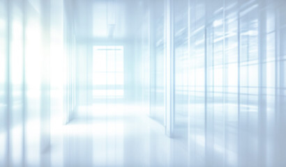 Light blurred background. The hall of an office or medical institution with panoramic windows and a perspective.