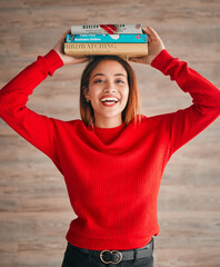 Canvas Print - Reading, student and woman with books on her head while studying in college for a test or exam. Thinking, thoughtful and young female with stories, novels or fiction standing by a wall in the library