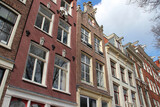 Fototapeta Big Ben - old houses at geldersekade in amsterdam in netherlands