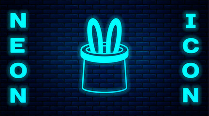 Wall Mural - Glowing neon Magician hat and rabbit ears icon isolated on brick wall background. Magic trick. Mystery entertainment concept. Vector