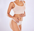 © Malik/peopleimages.com - Body, underwear and stomach of a woman or natural model with smooth skin isolated in a studio white background. Weight loss, diet and female touch belly for healthcare, fitness and nutrition