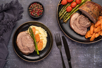 Wall Mural - Food photography of roasted lamb, carrot, asparagus, tomato, seasoning, pepper