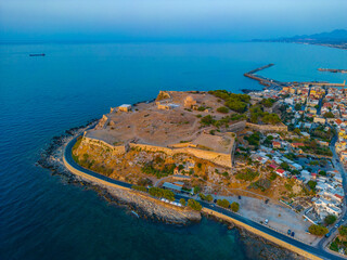 Wall Mural - Sunset aerial view of Venetian Fortezza Castle in Greek town Rethimno, Crete