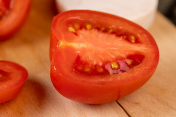 Sliced ripe red tomato on the table