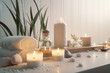 Beauty treatment items for spa procedures on a white wooden table. massage stones, essential oils, and sea salt. generative ai