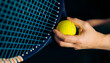 tennis player in action, racket with ball in hands