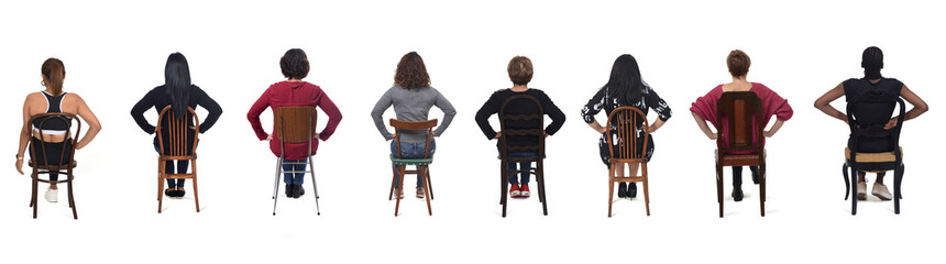 Wall Mural - group of woman sitting on chair with arms akimbo on white background