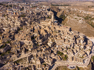 Canvas Print - View from above, stunning aerial view of the Matera s skyline during a beautiful sunrise. Matera is a city on a rocky outcrop in the region of Basilicata