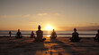 © Mr. Bolota - Sunset Yoga. A group of yogis practicing on a beautiful beach at sunset. Health and wellness concept. AI Generative