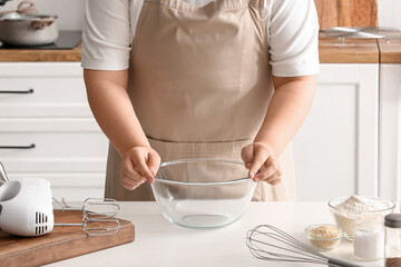 Wall Mural - Woman preparing dough for Italian Grissini at table in kitchen, closeup