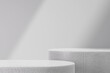 © Tuan  Nguyen  - Abstract white background for product presentation with 3d render two podium on smooth wall background and light-dark divider. Pedestal for cosmetic product and packaging mockups display presentation