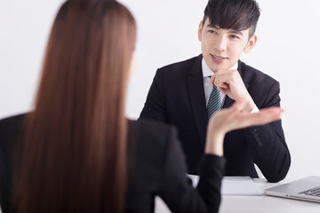 Wall Mural - Business manager interviewing young women job applicant in the office