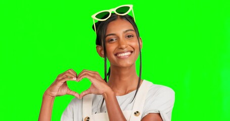 Wall Mural - Heart sign, green screen face and happy woman with love gesture for support, romantic care or mockup kindness. Emoji icon symbol, motivation portrait and female chroma key model on studio background