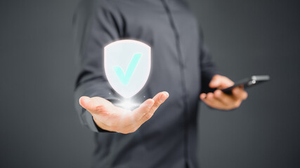 Poster - Man showing the shield protect icon. Protection personal data and network security computer concept. Cyber security and protection against danger. The best quality assurance product and service.