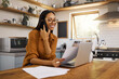 © Nina/peopleimages.com - Woman, phone call and working from home with laptop, paperwork and communication with technology. Happy female employee, remote work and networking or telemarketing, sales and telecom with document