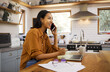 © Nina/peopleimages.com - Woman, phone call and remote work with laptop, conversation and communication with technology. Female freelance employee talking, working from home with networking or telemarketing, sales and telecom