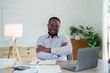 © Jirapong - middle aged man American African business man holding computer laptop with hands up in winner is gesture, Happy to be successful celebrating achievement success