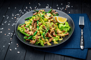 Canvas Print - Grilled meat salad with green beans and mustard sauce.