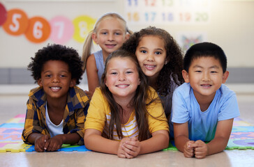 Poster - Education, portrait or happy children in classroom learning or smiling in preschool together with support. Kids development, diversity or students with growth mindset for knowledge in kindergarten