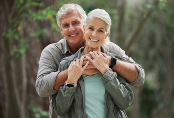 Wall Mural - Hug, hiking and portrait of senior couple with smile on adventure in forest, woods and mountain for exercise. Fitness, retirement and happy elderly man and woman trekking, walk and hike for wellness