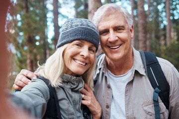 Canvas Print - Old couple, selfie and hiking in forest, happy people in portrait, nature and memory for social media post. Smile in picture, adventure and fitness, man and woman with active retirement and outdoor