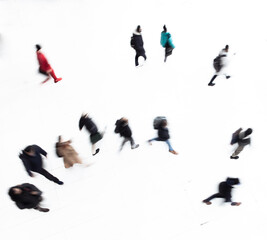 people silhouettes while walking with intentional motion blur