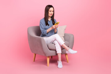 Sticker - Full length photo of confident influencer business blogger mature age texting woman colleagues sitting armchair isolated on pink color background