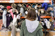 Teen Shopping For Fabric At The Recycle Centre