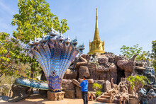 Kalasin, Thailand, February 1, 2023. Buddhist Men Pay Respect To The Blue 9 Heads Naga At Phu Dan Hai Temple, Kuchinarai District, Kalasin Province, Thailand.