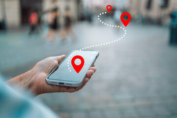 Tourist using navigation app on the mobile phone. High quality photo