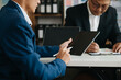 © Nuttapong punna - Business team meeting present.professional investor working with Finance managers task. with digital tablet,smartphone and laptop at office.