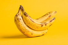 Bunch Of Ripe Bananas On A Yellow Background