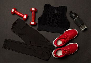 Wall Mural - Black gym outfit on color background, top view