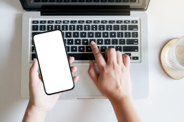 Hand holding empty white screen smart phone on white background.